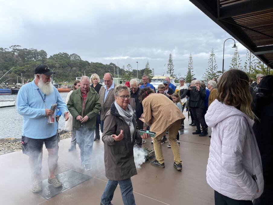 The smoking ceremony conduted by Nathan Lygon at the official opening of the whale festival on Friday October 7 at the Eden Visitor Information Centre. Picture by Denise Dion. 