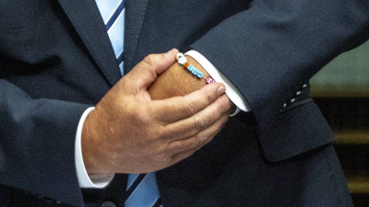 Wearing a ScoMo bracelet, the former Prime Minister Scott Morrison has given his valedictory speech. Picture by Gary Ramage