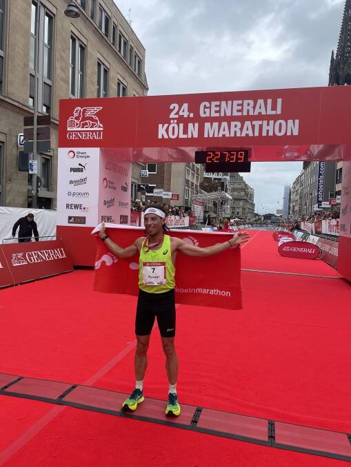 Russell Dessaix-Chin at the finish line of the Cologne Marathon. Picture by Christoph Edeler.