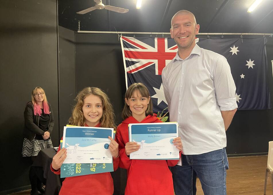 Years 3 & 4 winner Zara McCarthy and runner-up Molly Brewer with Eurobodalla Mayor Mathew Hatcher. Picture by Eurobodalla Shire Council.
