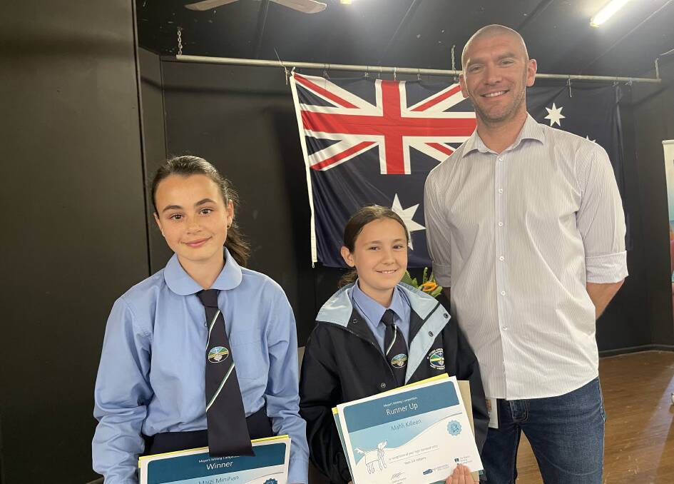 Years 5 & 6 winner Maizi Minihan and runner-up Mahli Killeen with Mayor Mat Hatcher. Picture by Eurobodalla Shire Council.