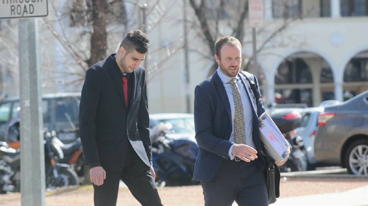 Hamdan (left) with his solicitor Jacob Robertson outside court on Monday. Picture by Toby Vue