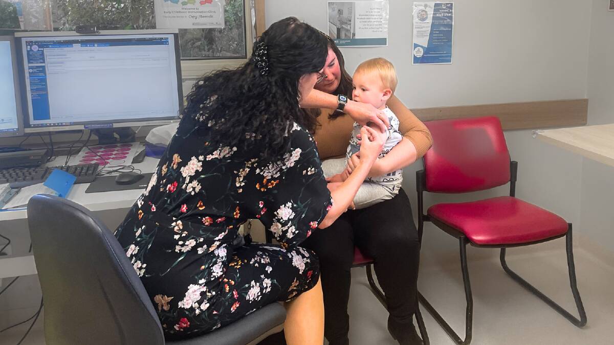 Alice Watt with baby Logan, who is getting his free flu vaccine at the Dickson Maternal and Child Health Centre. Picture by Lanie Tindale