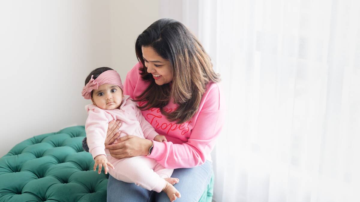 Benazir Badsha Zaidi with her eight-month-old daughter Alayna. Picture by Sitthixay Ditthavong