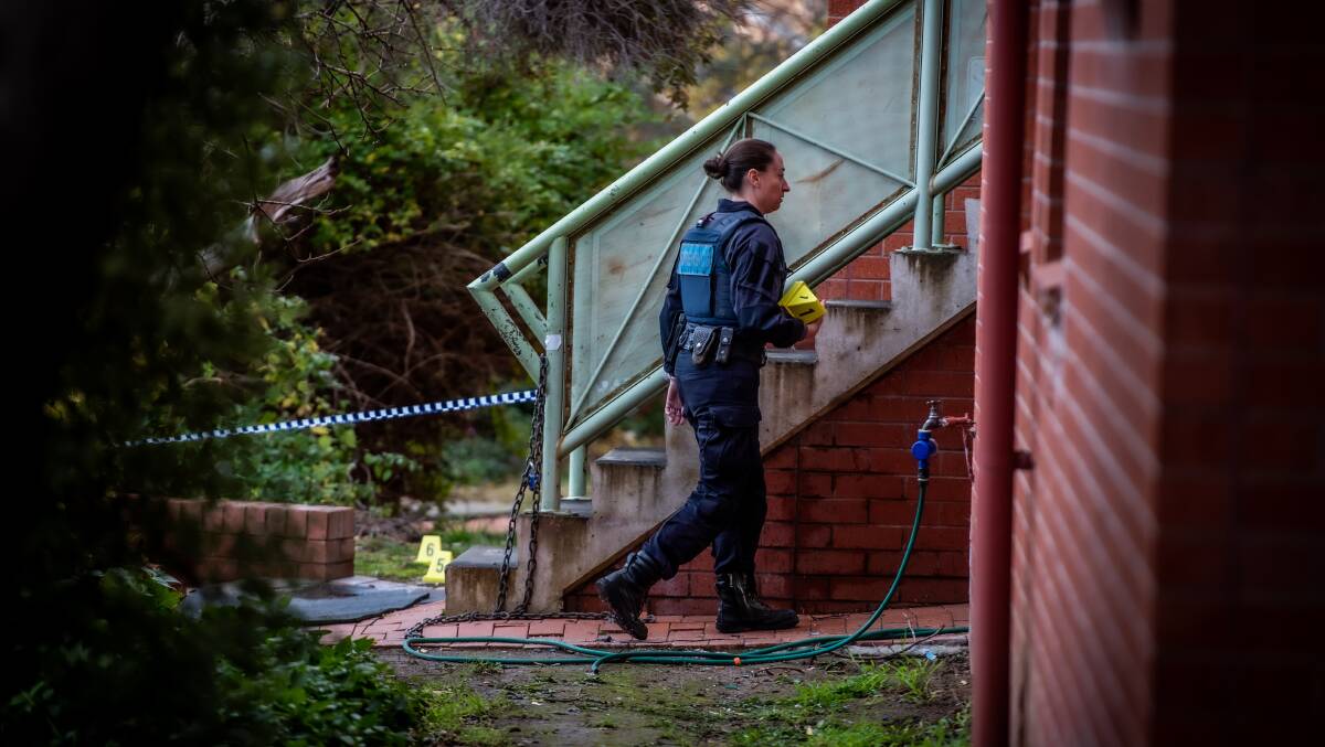 Police at the scene after Glenn Walewicz was killed at his home. Picture by Karleen Minney
