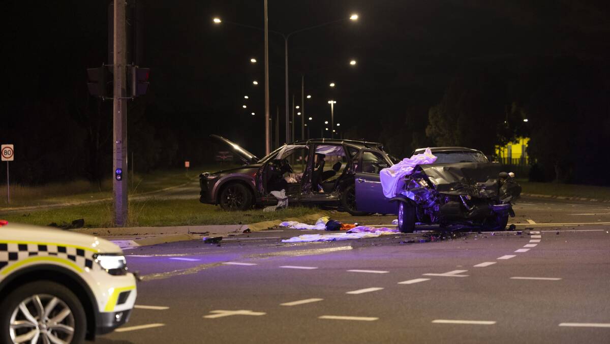 Two cars involved in a crash at the intersection of Gungahlin Drive and Well Station Drive on Saturday night. Picture by Keegan Carroll