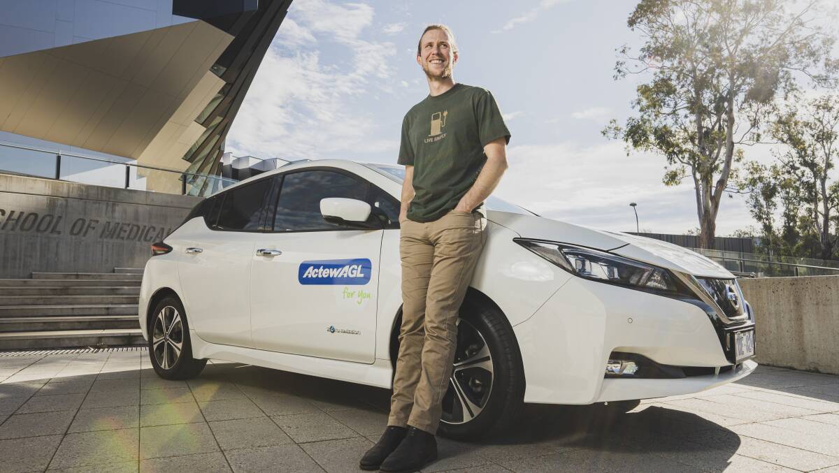 Dr Bjorn Sturmberg with an Actew AGL Nissan Leaf. Picture by Dion Georgopoulos