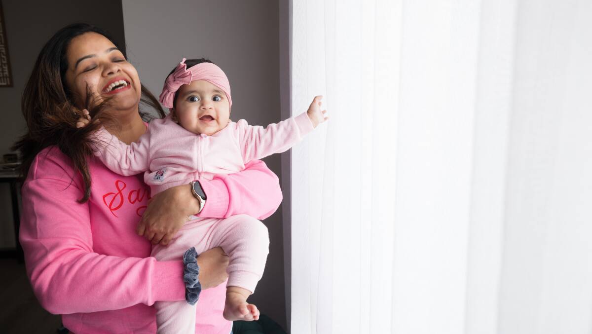 Benazir Badsha Zaidi with her eight-month-old daughter Alayna at home in Taylor, the Canberra suburb with the highest fertility rate in 2023. Picture by Sitthixay Ditthavong