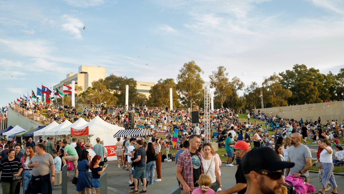 Canberrans pack Queen Elizabeth Terrace on Australia Day 2023 to watch Lights on the Lake. Picture by Sitthixay Ditthavong
