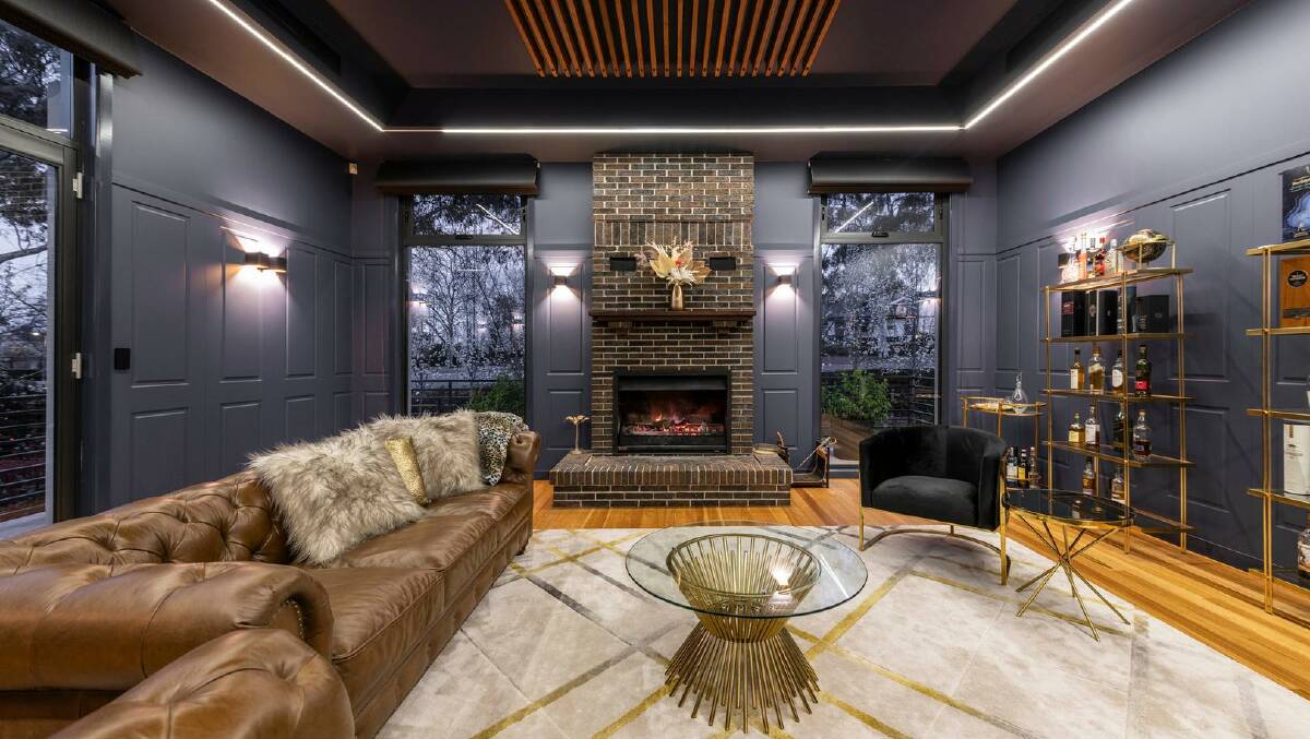Inside the house is a lavish whisky room with a fireplace. Picture supplied