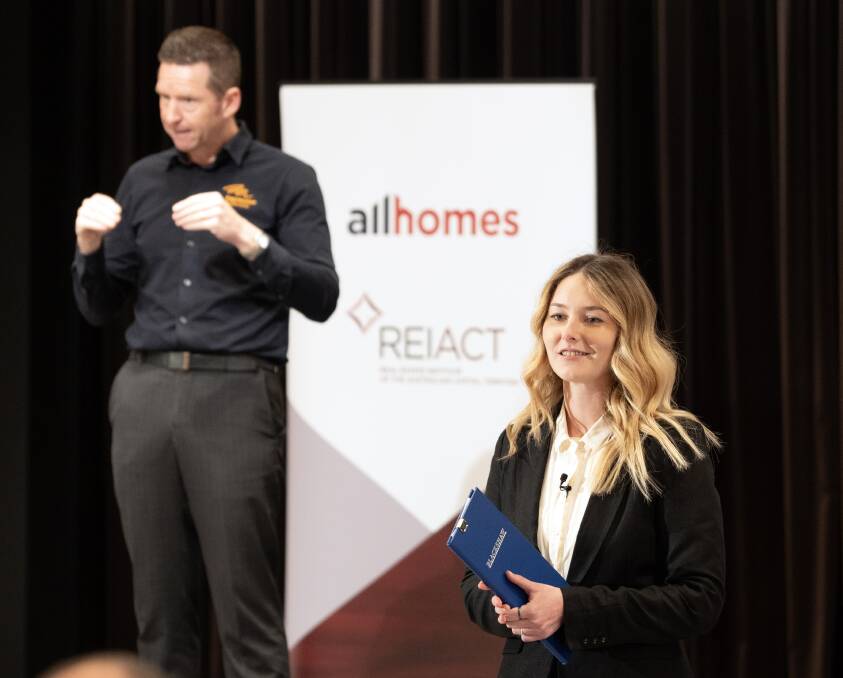 Auctioneer Stephanie Steenbuck competes in the auction event as Mark Quinn provides Auslan interpretation. Picture supplied