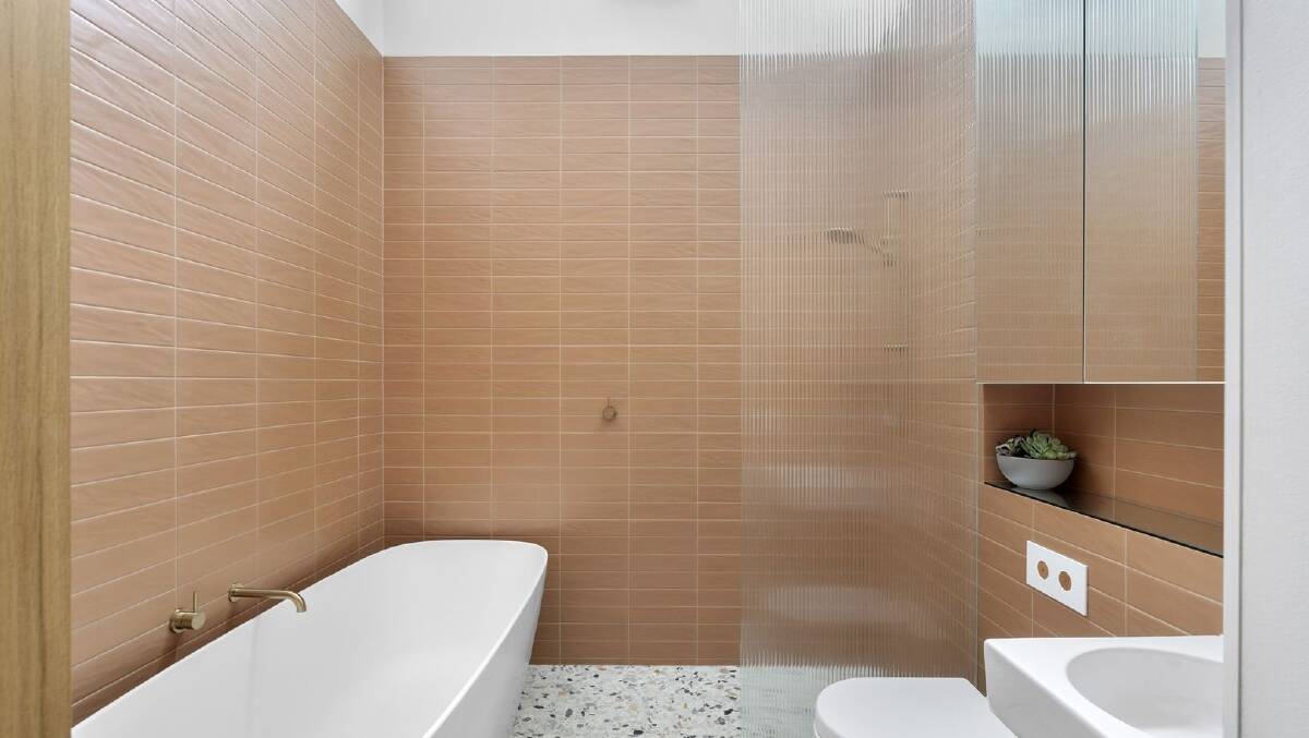 The townhouse includes two bathrooms and a powder room. Picture supplied