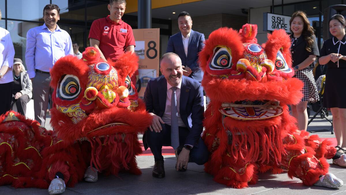 ACT Chief Minister Andrew Barr with lion dancers at the opening of Dickson Village. Picture by Keegan Carroll