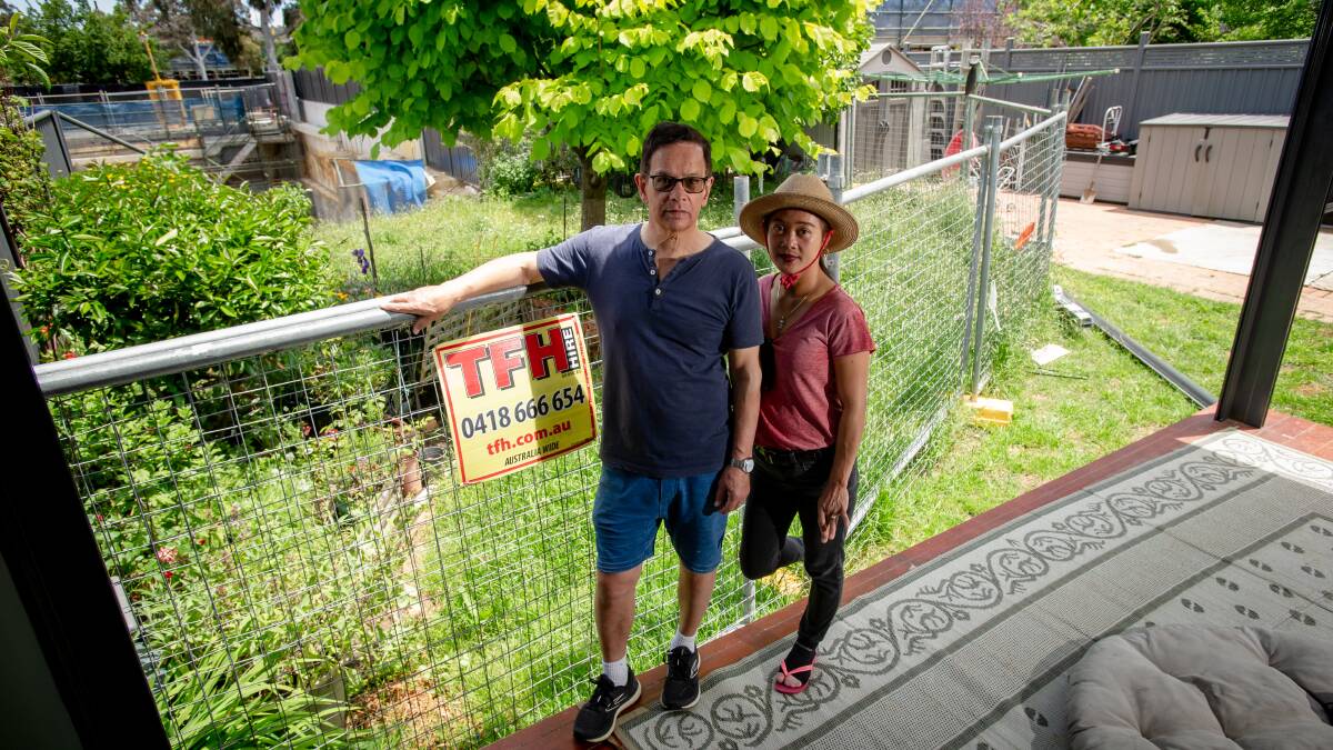 Alan and Irene Barber have given up hope of a backyard Christmas this year after an excavation pit behind their house collapsed. Picture by Elesa Kurtz