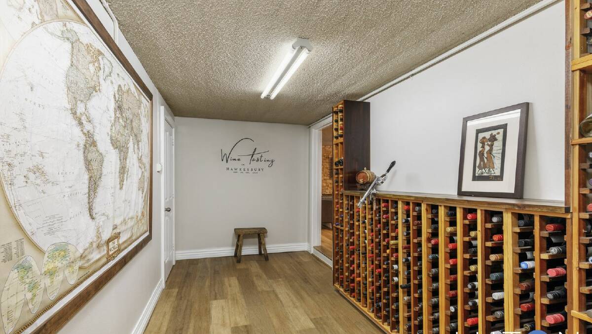 The home features a wine cellar established "in iso", as the wall decal states. Picture supplied