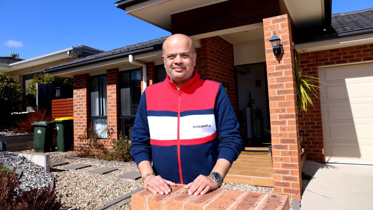 Satyam Dalal, pictured outside his house in Bonner, has been planning for interest rates rises. Picture by James Croucher