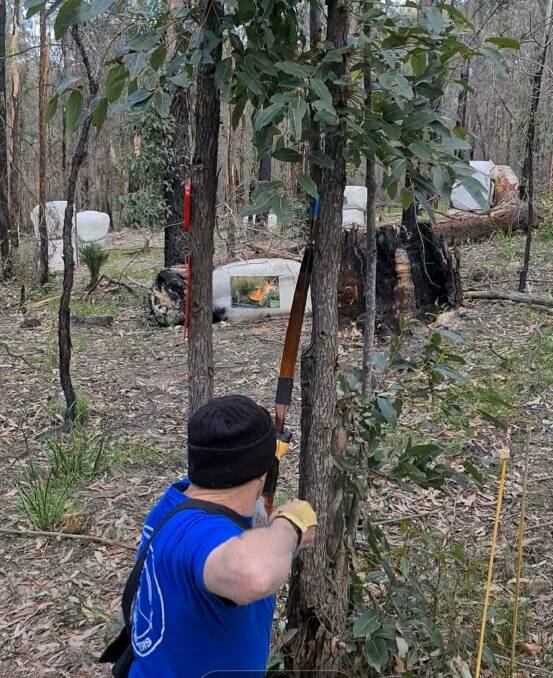 An archer shooting at a fox target using a traditional bow. Picture supplied by Eurobodalla Archery Club Facebook.