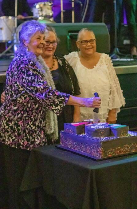 Aunty Dorie Moore, Lorraine Naylor and Lynette Goodwin cutting a cake at the Katungal NAIDOC 2022 awards night. Picture: supplied