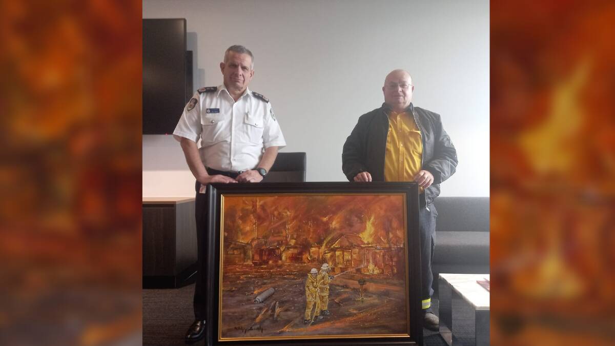 Ritchey Sealy (left) presenting his work to NSW RFS Commissioner Rob Rogers in the RFS Operations Centre, Sydney. Picture supplied.