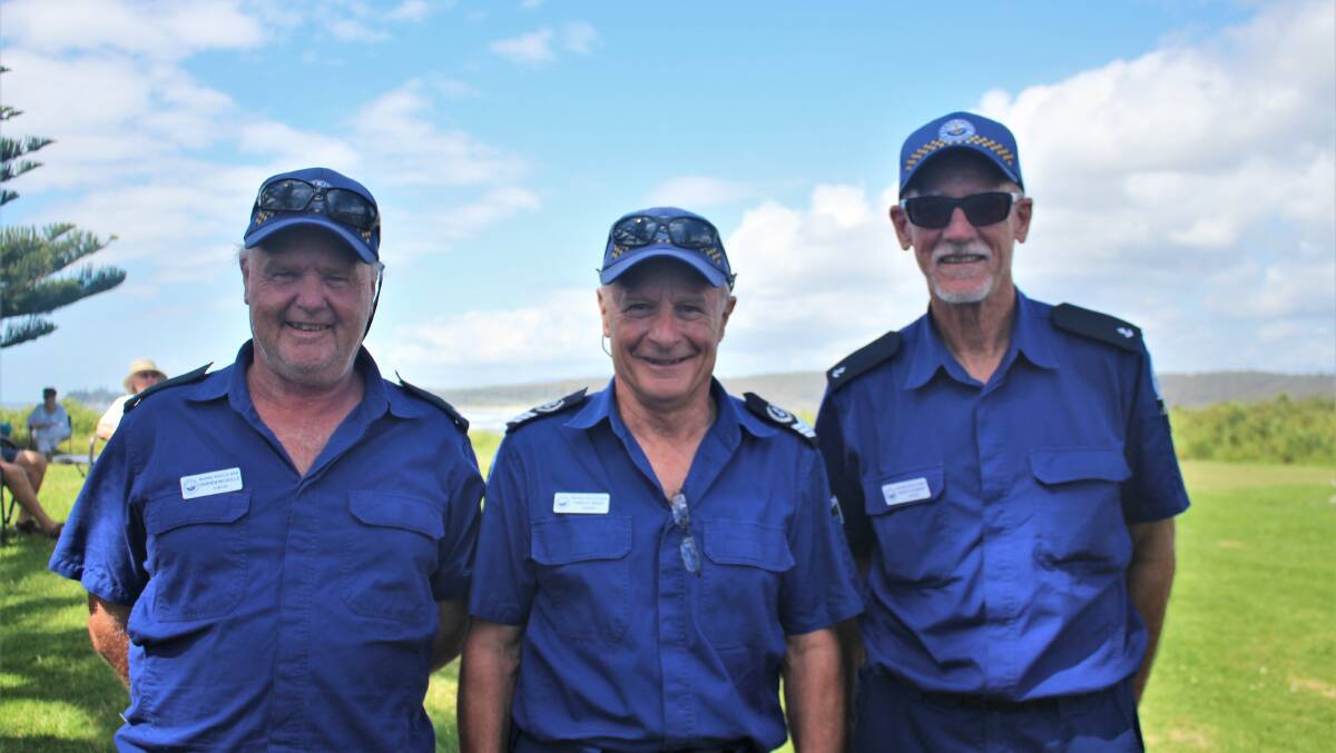 Tuross Head Marine Rescue volunteers Darren Nicholls, Geoff Starkey and Harley Moss took a break from the barbeque to pose for a picture after a busy morning of volunteering