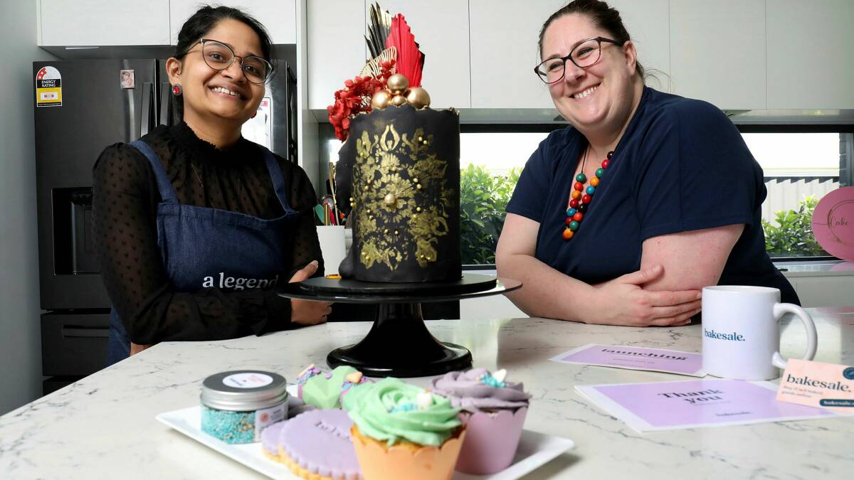 Andrea Butler, founder of Bakesale, a new online marketplace for baked goods in Canberra, with baker Dee Vijayakumaran at her home in Taylor. Picture by James Croucher
