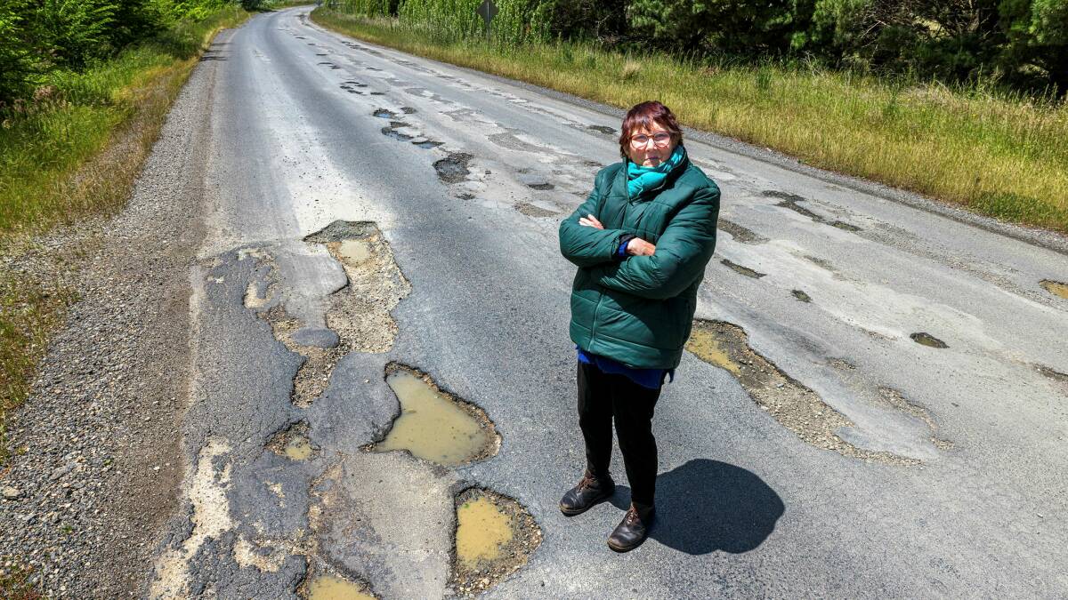 Tarago resident Julie Gray said the Queanbeyan-Palerang Regional Council needs to repair the pothole-strewn road between Bungendore and Tarago after two years of damage. Picture by Sitthixay Ditthavong