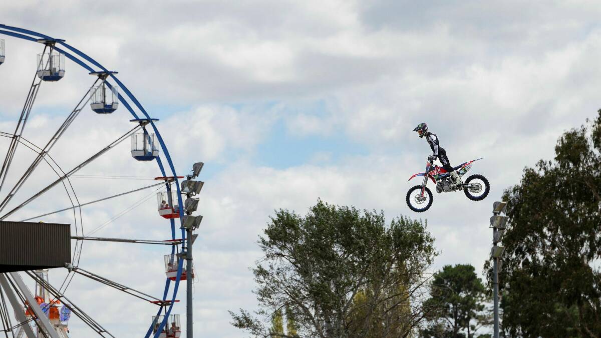 Airtime freestyle motorcross team in the main arena at the Canberra Show on Friday. Picture by Sitthixay Ditthavong