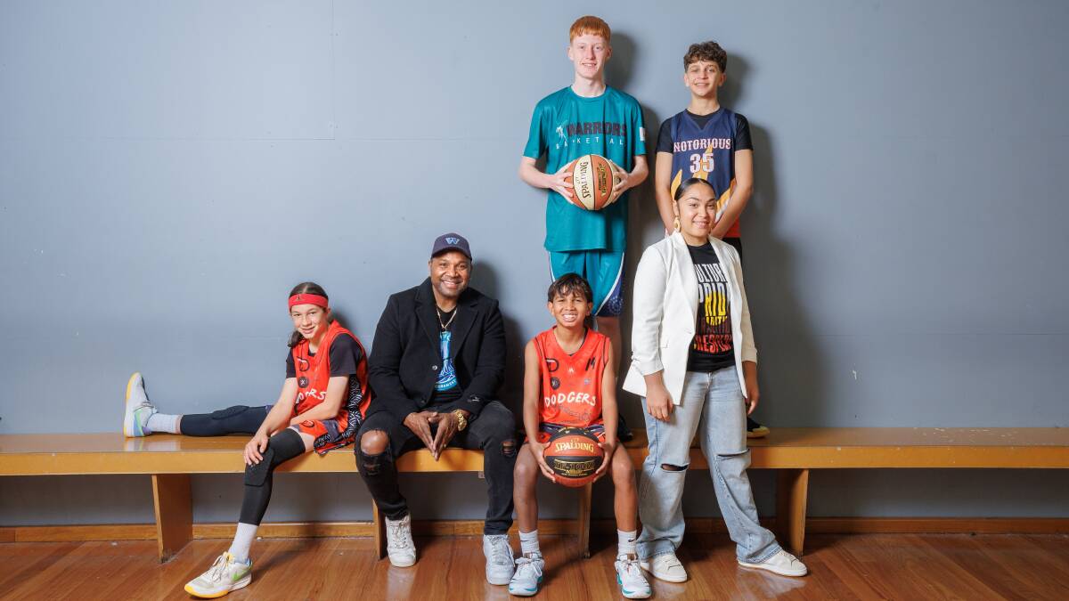 Dion Devow and Tahalianna Soward-Mahanga with basketballers Marcelo Kerr Azevedo, Noah Dodson-Shaw, Jake Walsh, and Leonardo La Tella. Picture by Sitthixay Ditthavong