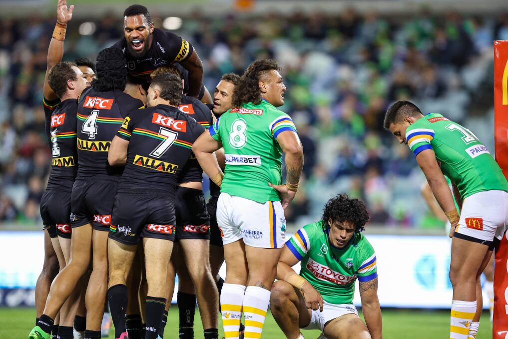 The Panthers celebrate a try by Tyrone Peachey while the Raiders look deflated. Picture by Sitthixay Ditthavong