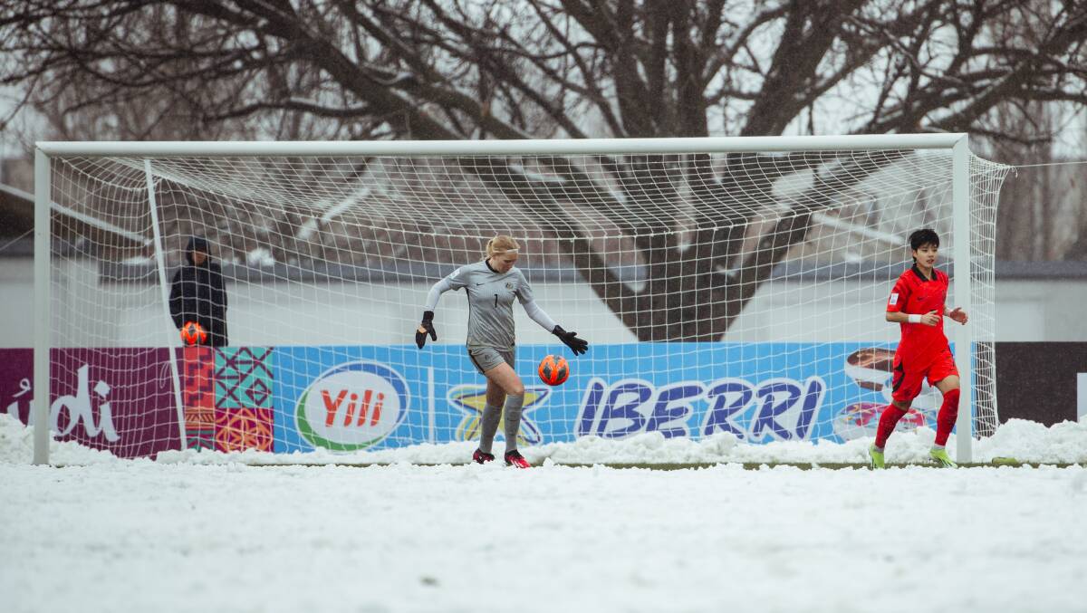 Canberra star Chloe Lincoln battling the elements. Picture Football Australia