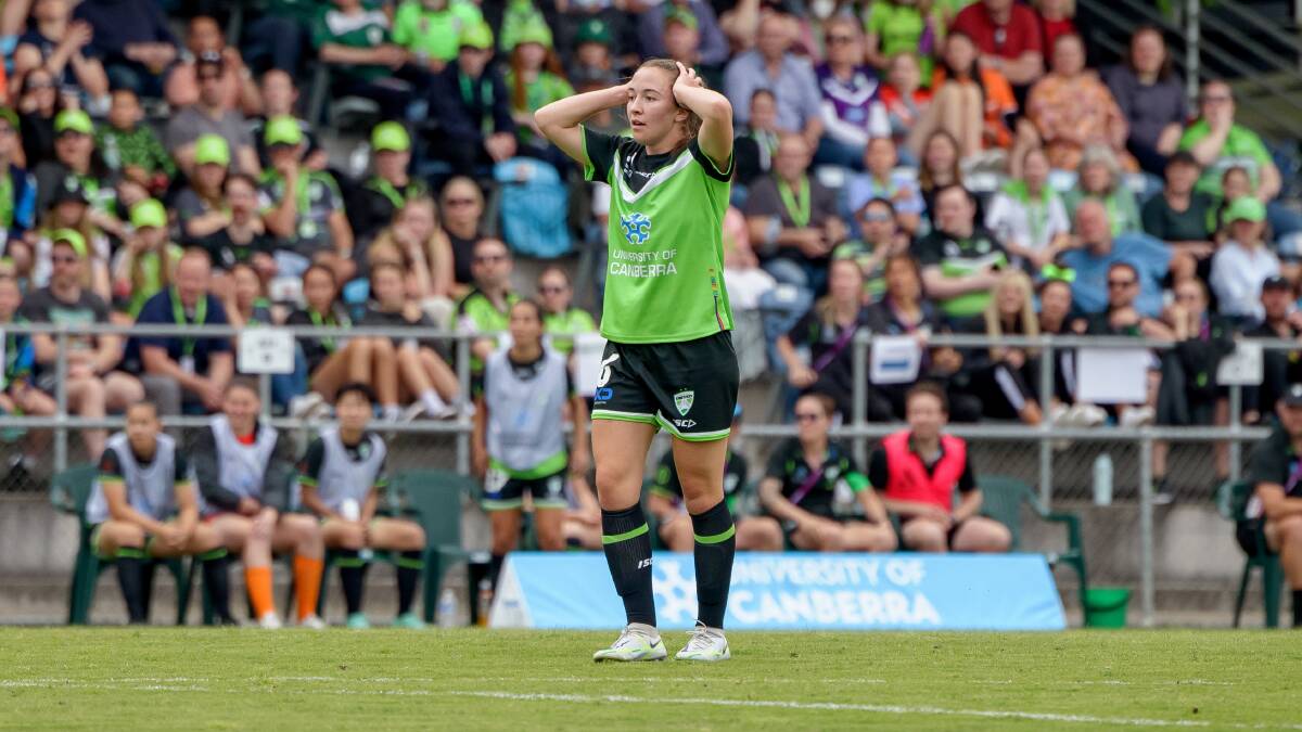 Canberra United's Laura Hughes reacts after missing a shot at goal in their season-opener Picture by Sitthixay Ditthavong