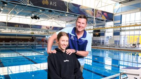 Teenage swimmer Ava Rollason and her dad and coach Shannon Rollason. Picture by Sitthixay Ditthavong