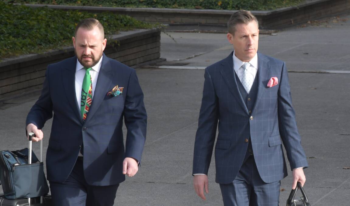 Ben Aulich, right, arrives at court on Monday with solicitor Peter Woodhouse. Picture by Tim Piccione 