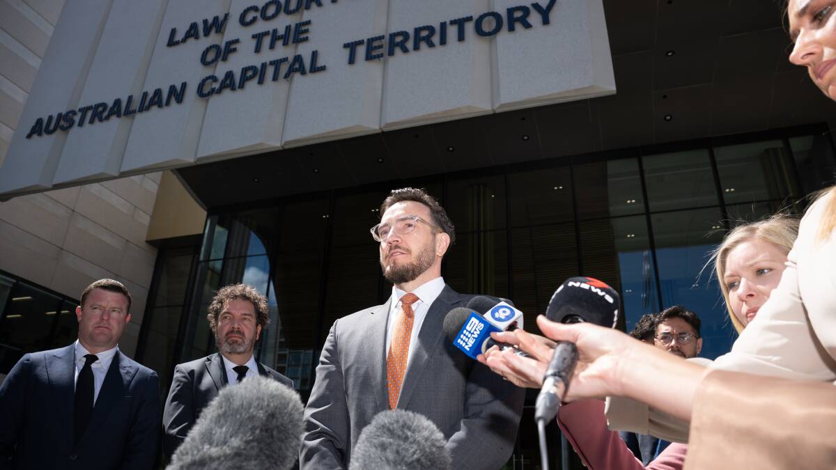 Solicitor Tom Taylor addresses media outside court following the dismissed charges. Picture by Sitthixay Ditthavong