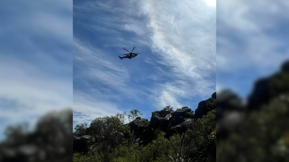 A police helicopter seen above the Pinnacle walk during the search. Picture by Tanya Lix