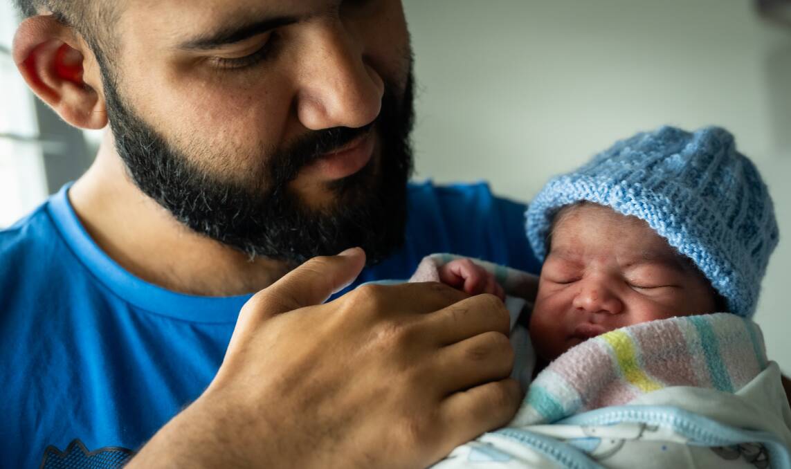 Saad Khan holds his new son Azlan Khan after mum Maryam Khan gave birth at North Canberra Hospital, one of two locations trialling the new system. Picture by Karleen Minney.