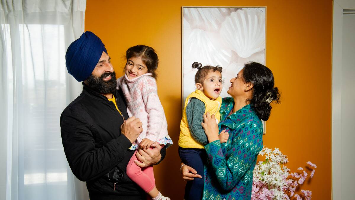 Jarnail Singh, a truck driver for postal services, is happy with his decision to call Canberra home. Pictured with his family members, Gurjaap Kaur, 4, Uqaab Kaur, 2 and wife Bhawandeep Kaur. Picture by Elesa Kurtz