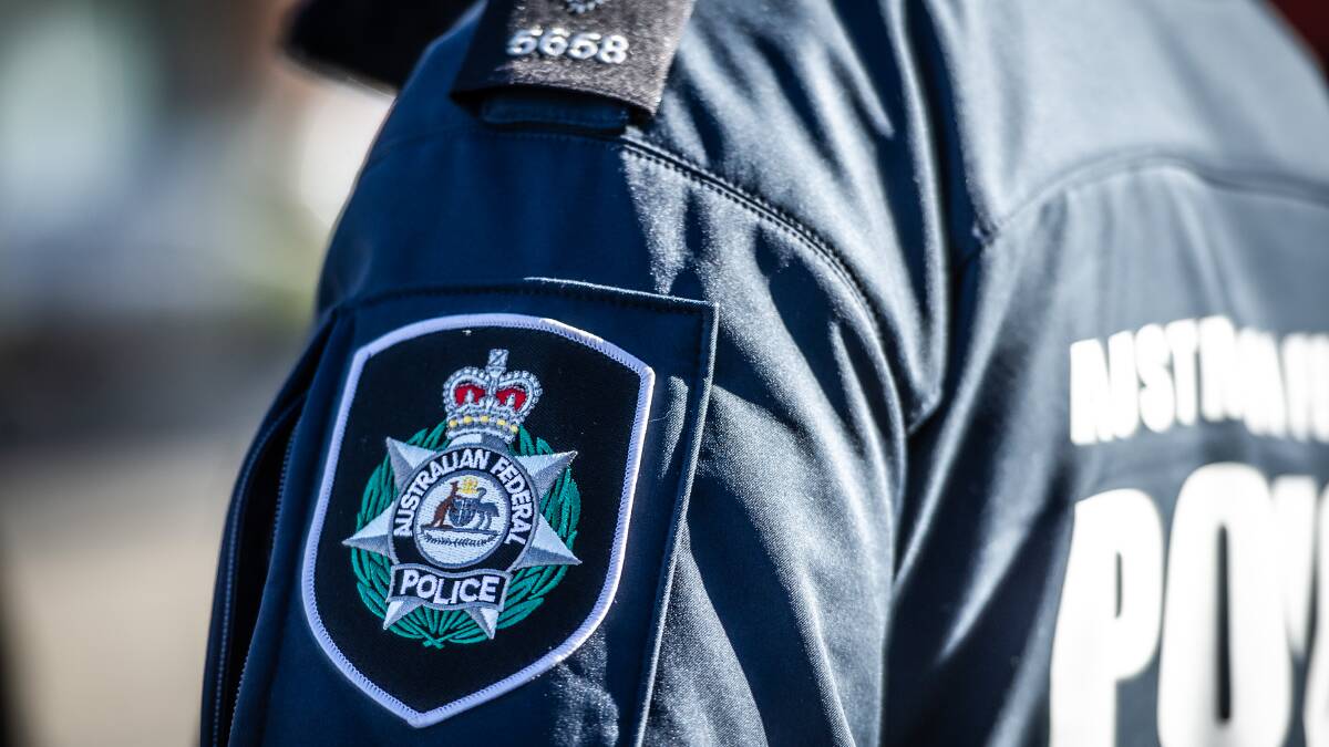 The Australian Federal Police emblem seen on a uniformed officer. Picture by Karleen Minney