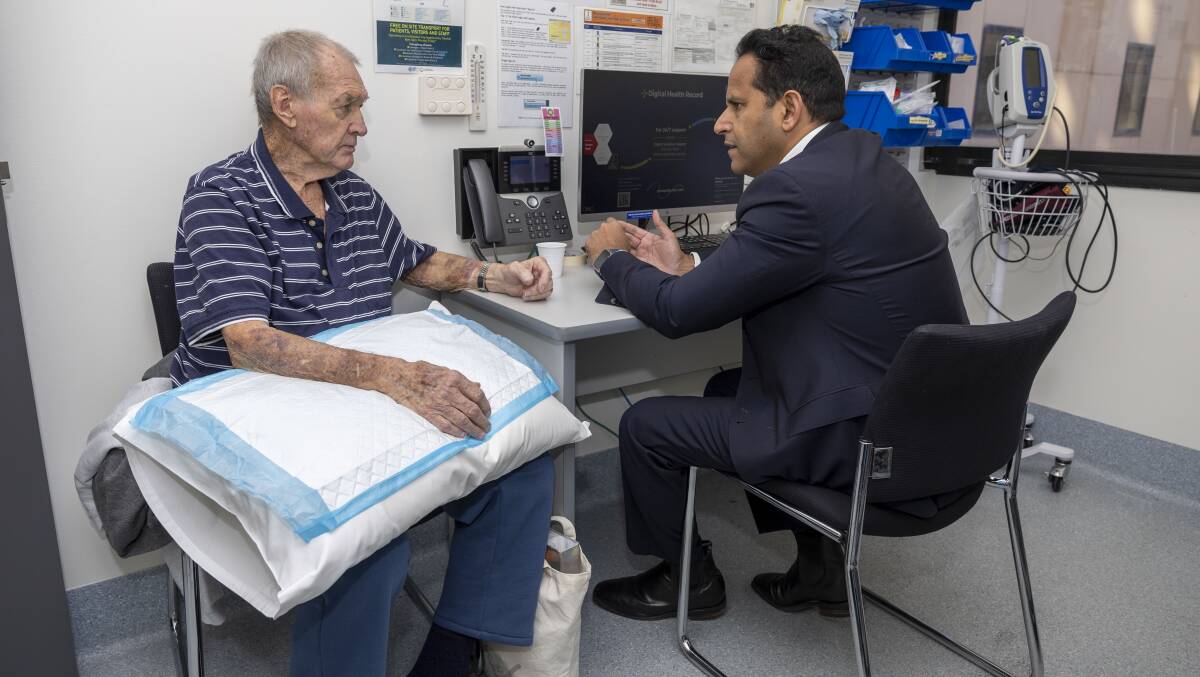 Cardiologist Dr Walter Abhayaratna, right, meets clinical trial participant Brian Jelfs every week at Canberra Hospital. Picture by Gary Ramage
