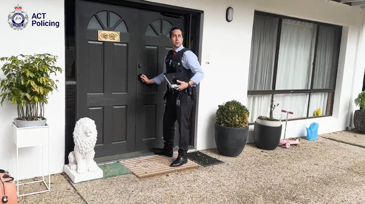 Officers from ACT Policing's sexual assault and child abuse team at the O'Malley residence where the alleged victim of human trafficking was found. Picture via ACT Policing