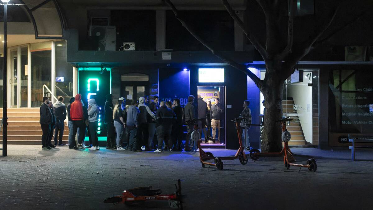 Clubgoers stand outside Cube nightclub. Picture by Keegan Carroll
