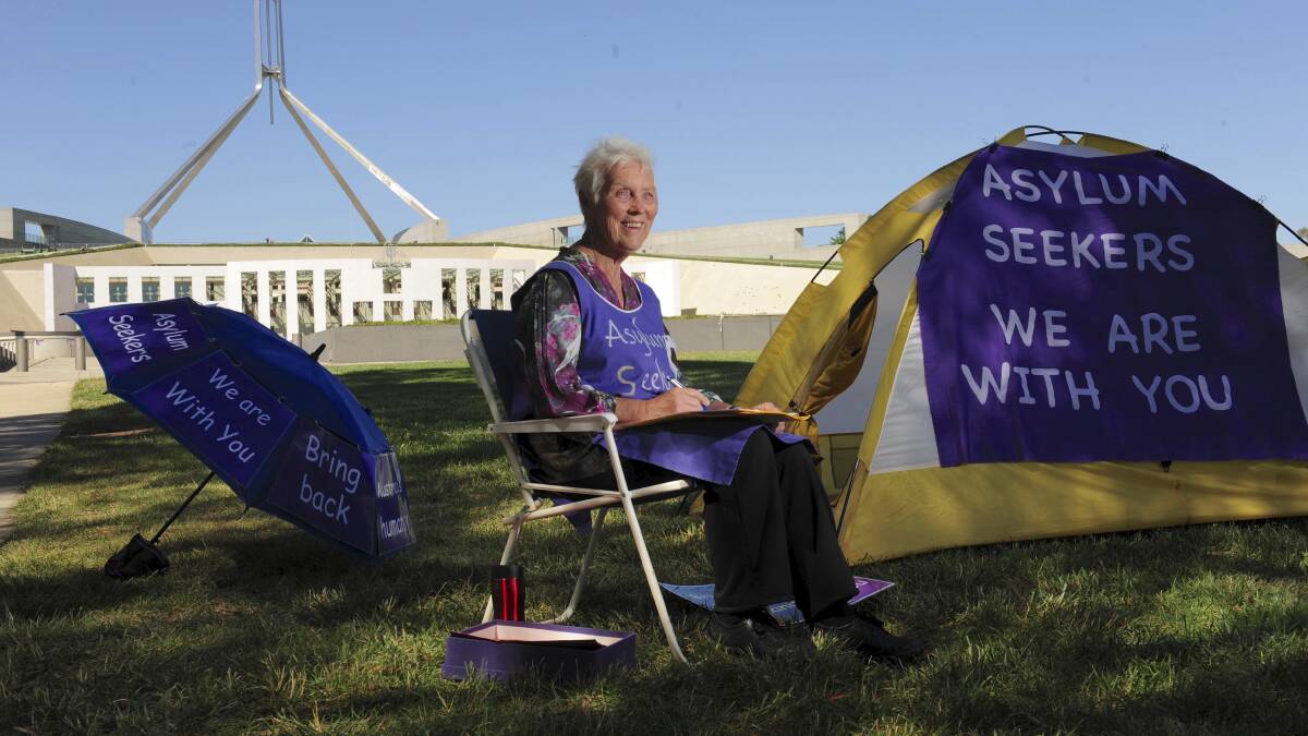 Sister Jane Keogh has been appointed as a member of the Order of Australia. Here she is pictured in a solo demonstration in front of Parliament House in 2015 to express solidarity with asylum seekers on Nauru and Manus Island. Picture by Graham Tidy 