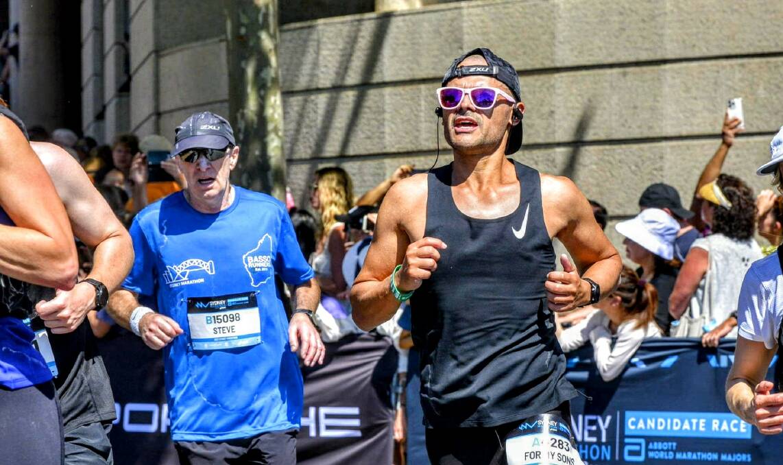 Cystic fibrosis fighter Adrian Flor (right) ran his first marathon in Sydney in September. Picture supplied