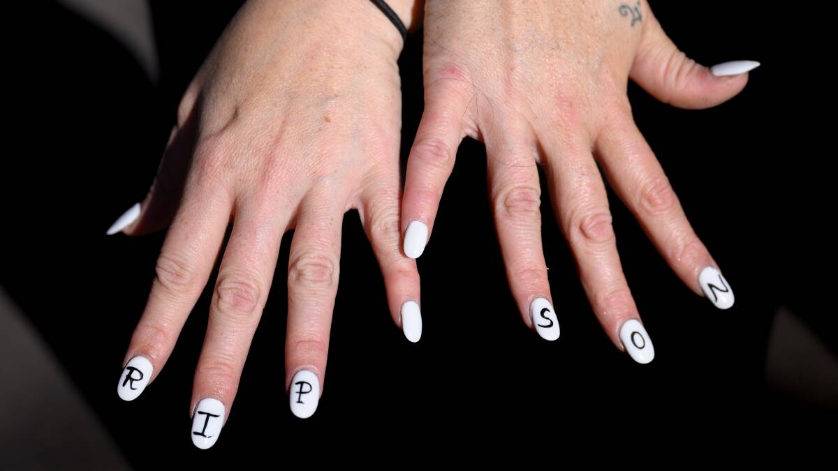 The mother of a 15-year-old who died in a single vehicle accident at Capital on April 17, 2024, painted her nails with the words 'RIP Son' at his funeral service on Wednesday. Picture by Sitthixay Ditthavong