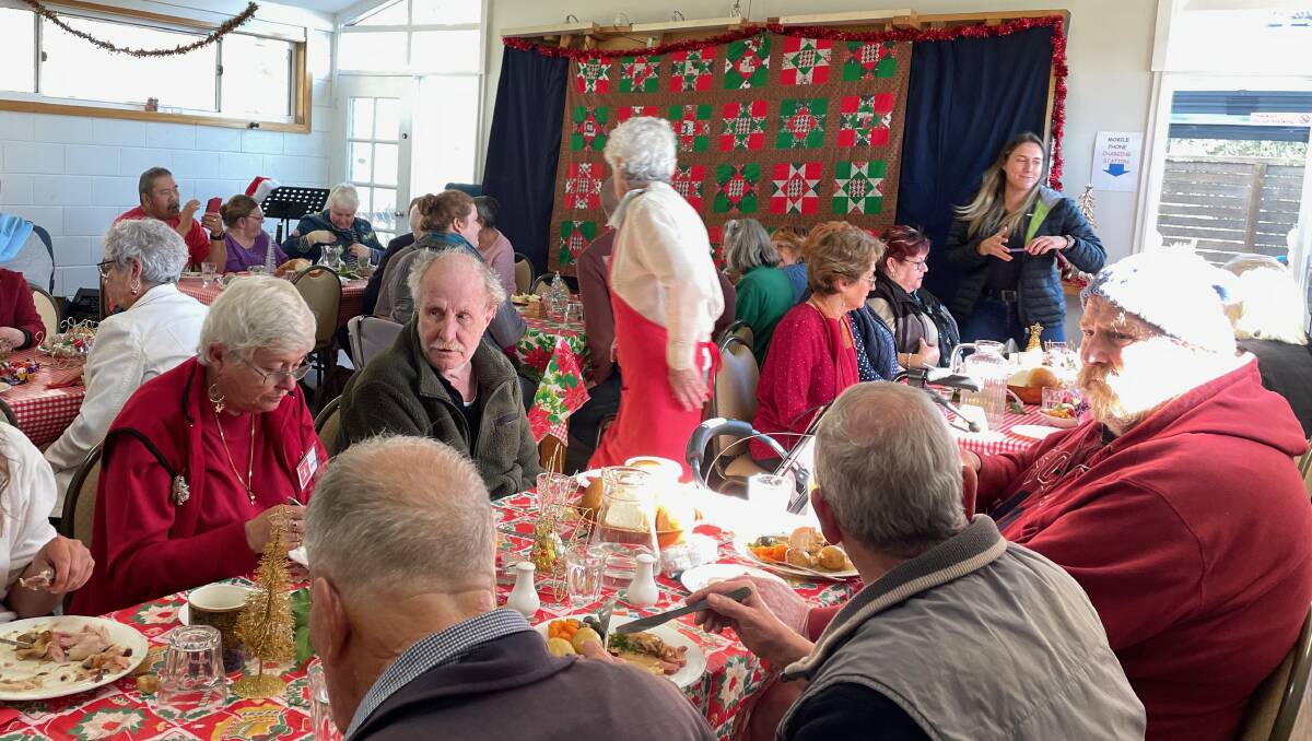 The good-hearted volunteers at Monty's Place were flat out taking orders and serving meals for Christmas in July in Narooma on Wednesday, July 26. Picture by Marion Williams