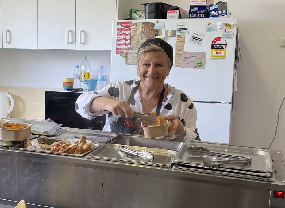 Volunteer Rikki dishing up meals at the ninth birthday celebrations for Monty's Place on Wednesday, October 19. Picture by Marion Williams