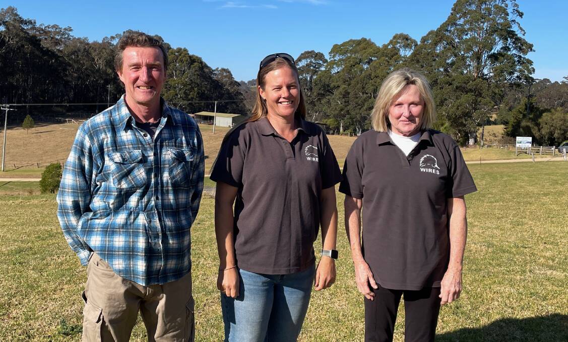 Michael Hooper of North Narooma with WIRES Mid South Coast raptor coordinators Sandy Collins and Shane O'Keefe. They were thrilled they could return the bird to its home around Black Bream Point in North Narooma. Picture by Marion Williams