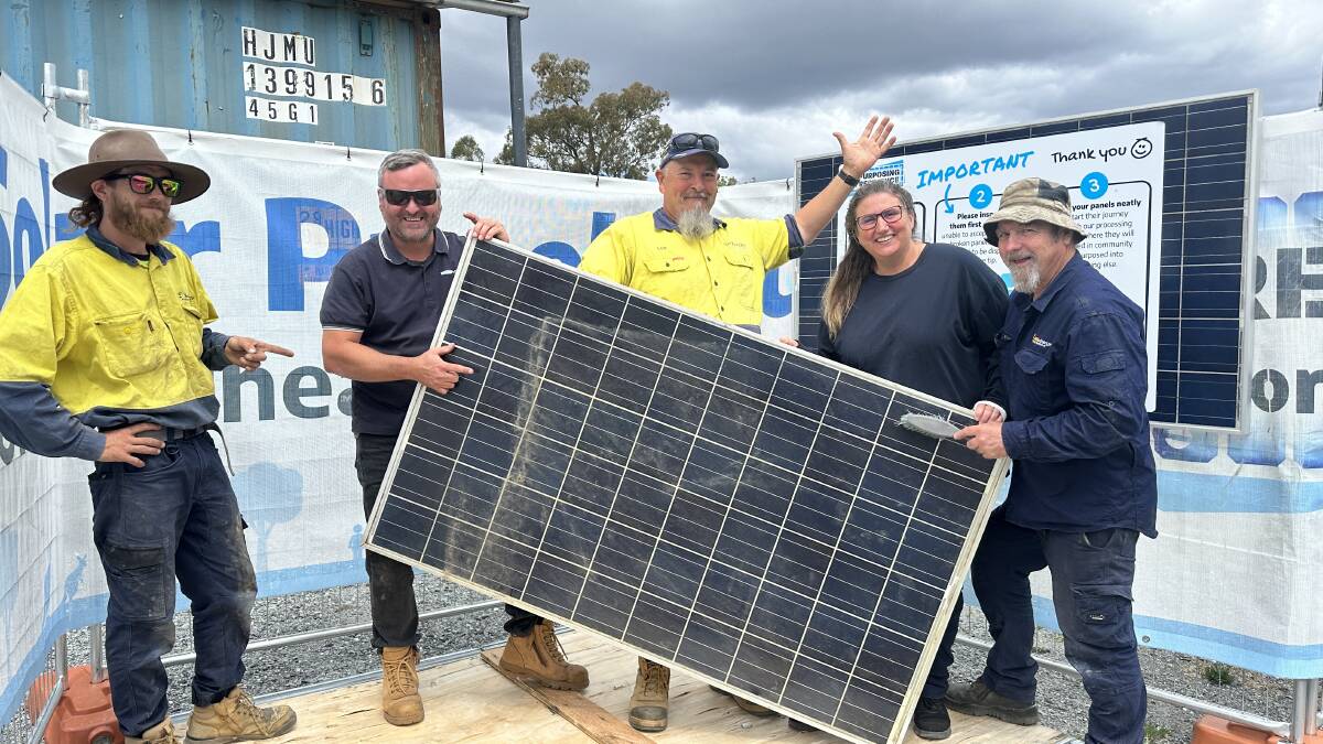 Repurposing for Resilience volunteers and Eurobodalla Shire Council's waste staff working together to give old solar panels a second life. 