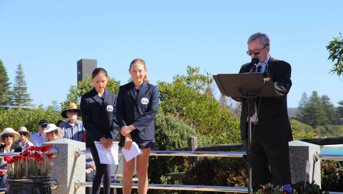 Bermagui Public School's Prime Minister Silver Farnham (right) and Deputy Prime Minister Lily Kirk (left) each read a poem at the Bermagui's Anzac Day service. Picture supplied. 