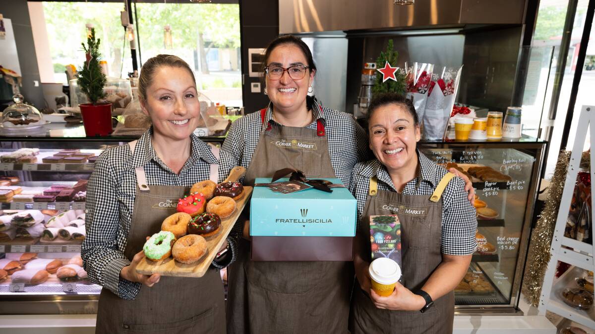 The Corner Market sisters Katherine Olmos, Veronica Olmos and Rebeca Sotomayor have baked special Christmas doughnuts and their cafe is open through the festive season. Picture by Elesa Kurtz